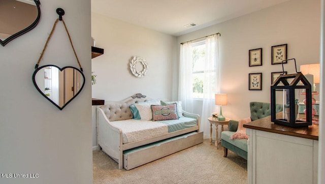 carpeted bedroom with baseboards