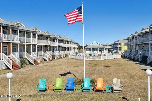 view of home's community featuring a yard