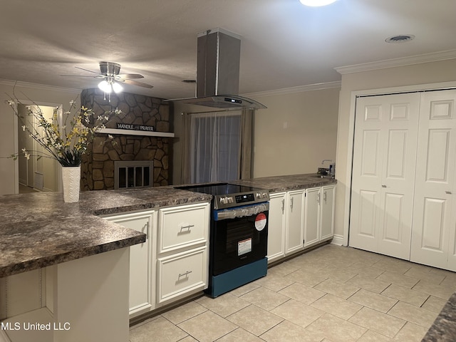 kitchen with island exhaust hood, kitchen peninsula, stainless steel electric range, and white cabinets