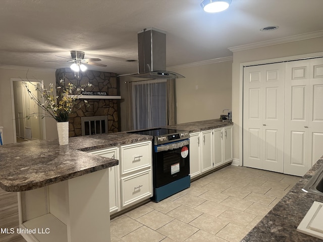 kitchen featuring white cabinetry, stainless steel electric range oven, island exhaust hood, and kitchen peninsula