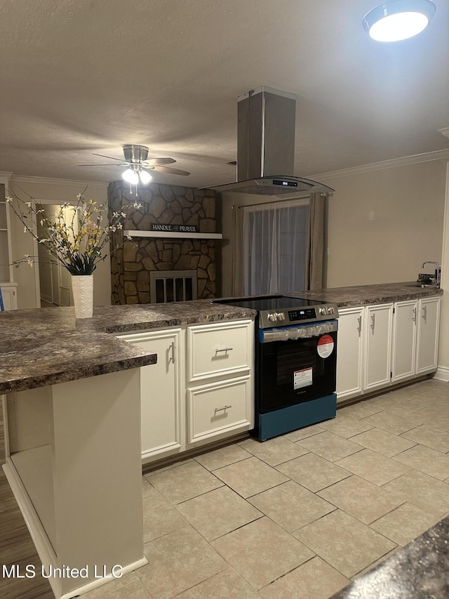 kitchen with stainless steel electric range oven, white cabinetry, ornamental molding, island exhaust hood, and kitchen peninsula