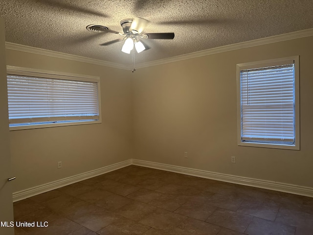 spare room featuring a textured ceiling, ornamental molding, and ceiling fan