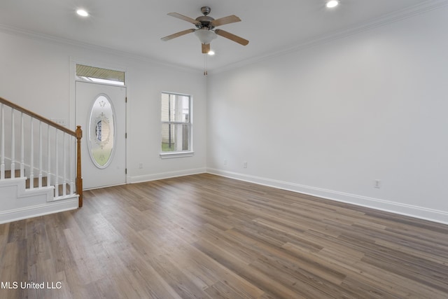 entryway with crown molding, ceiling fan, and hardwood / wood-style flooring