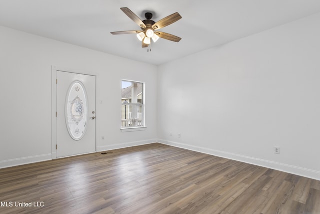 foyer featuring dark wood-type flooring and ceiling fan