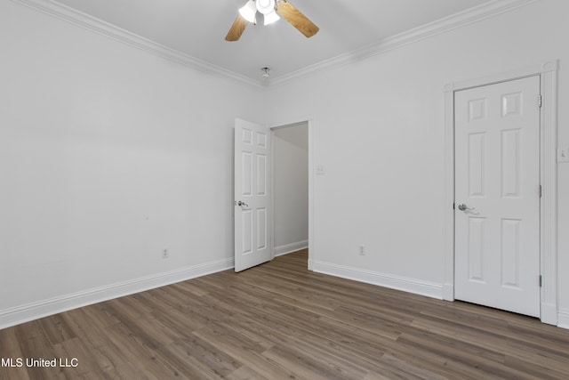 unfurnished room featuring ceiling fan, ornamental molding, and dark hardwood / wood-style floors