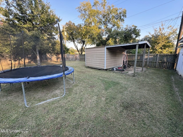 view of yard featuring a fenced backyard and a trampoline