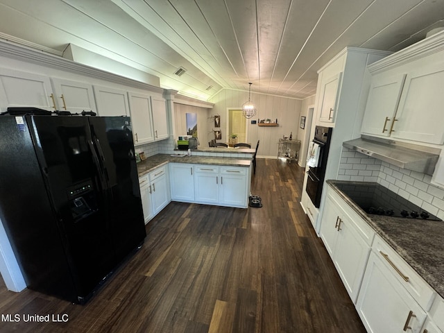 kitchen with black appliances, a peninsula, decorative backsplash, lofted ceiling, and dark wood-style flooring