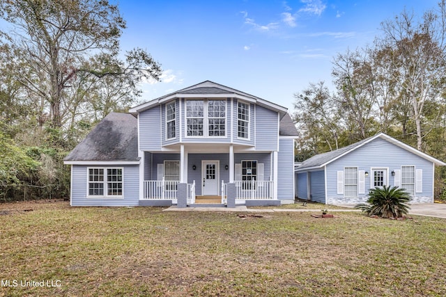 front of property featuring a front yard and a porch