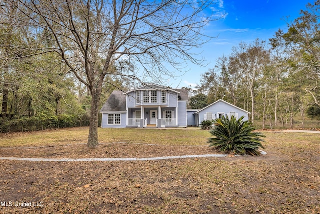 view of front of home featuring a front yard and a porch