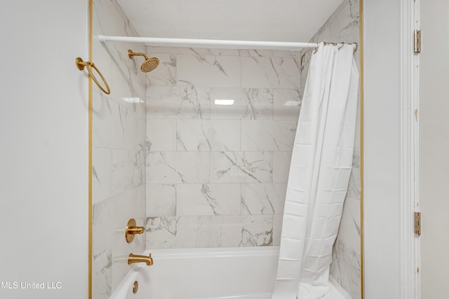 bathroom with shower / bathtub combination with curtain