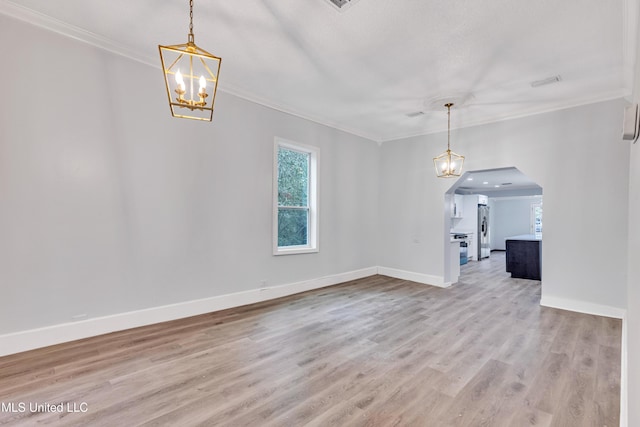 interior space featuring crown molding, an inviting chandelier, and light wood-type flooring