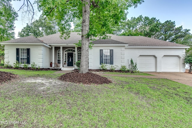 221 Boxwood Cir, Brandon, MS 39047 - ranch-style home with a garage, a front yard, driveway, and brick siding
