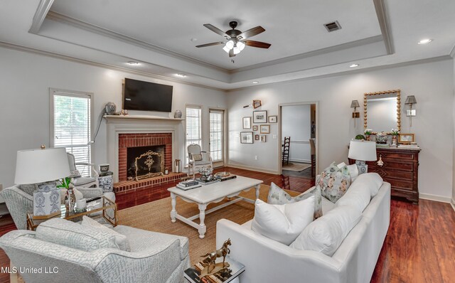221 Boxwood Cir, Brandon, MS 39047 - living area with a tray ceiling, wood finished floors, ornamental molding, a ceiling fan, and baseboards