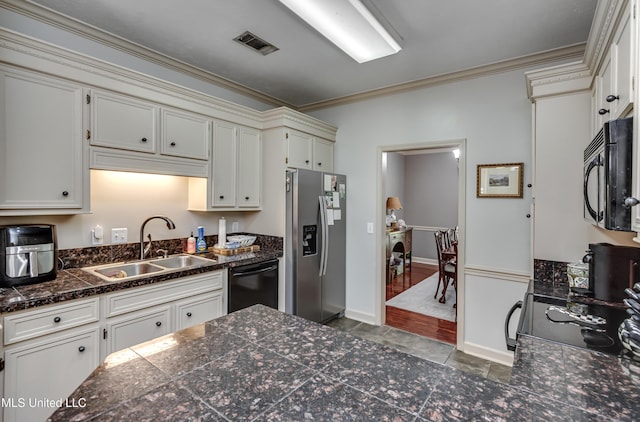 221 Boxwood Cir, Brandon, MS 39047 - kitchen with black appliances, a sink, tile countertops, crown molding, and baseboards
