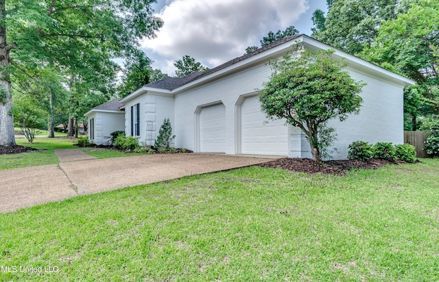 221 Boxwood Cir, Brandon, MS 39047 - view of front of house featuring concrete driveway, a garage, a front yard, brick siding, and roof with shingles