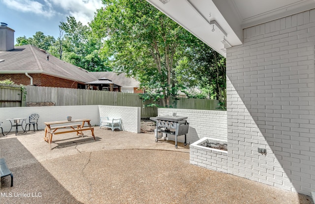 221 Boxwood Cir, Brandon, MS 39047 - fenced backyard featuring a patio area and outdoor dining space