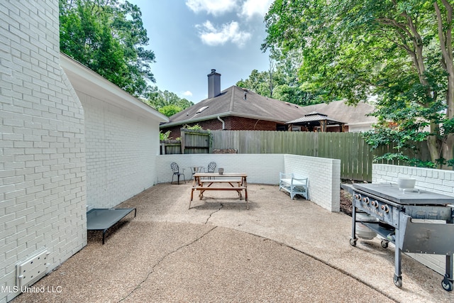221 Boxwood Cir, Brandon, MS 39047 - fenced backyard with outdoor dining area and a patio area