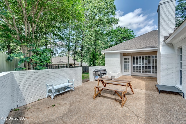 221 Boxwood Cir, Brandon, MS 39047 - fenced backyard with a patio area, area for grilling, and outdoor dining area