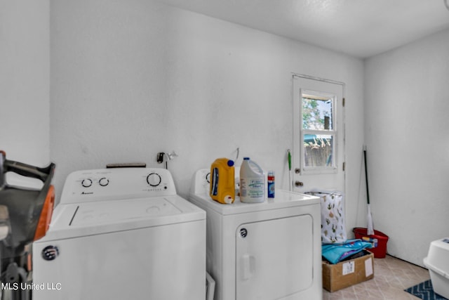 laundry room featuring washing machine and clothes dryer