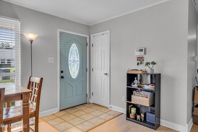 entrance foyer featuring light hardwood / wood-style floors and ornamental molding