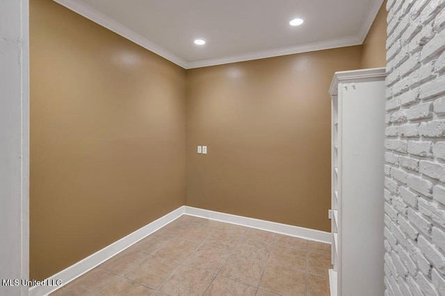 empty room with light tile patterned floors and ornamental molding