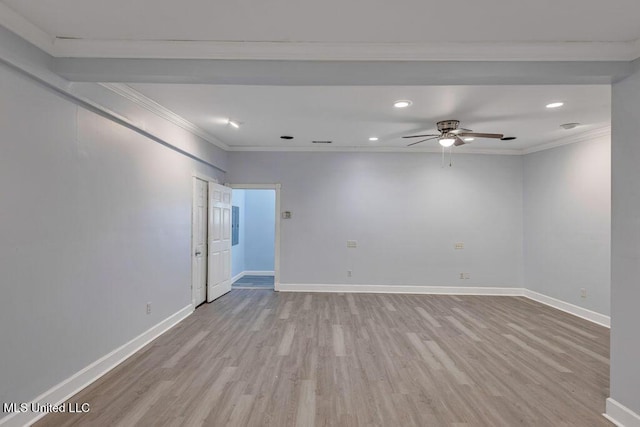 empty room featuring crown molding, ceiling fan, and light wood-type flooring