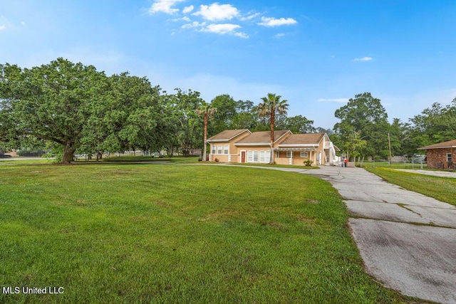 19 Poplar Cir, Gulfport, MS 39507 - ranch-style home featuring a front lawn and driveway