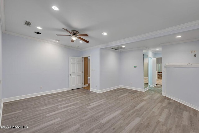 empty room featuring crown molding, ceiling fan, and light wood-type flooring