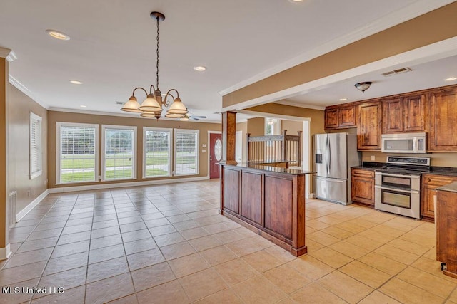 kitchen with decorative light fixtures, ceiling fan with notable chandelier, stainless steel appliances, and light tile patterned floors