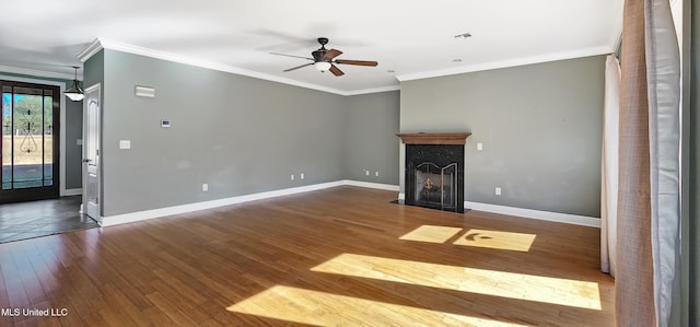 unfurnished living room with ceiling fan, dark hardwood / wood-style flooring, and ornamental molding