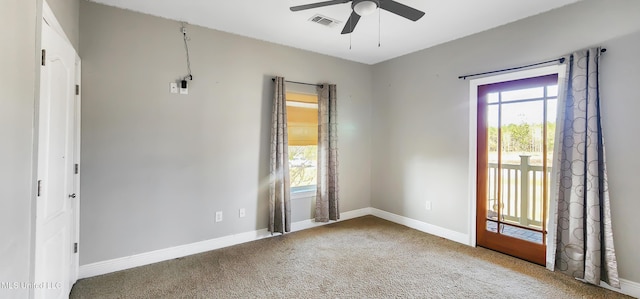 spare room with carpet flooring and ceiling fan