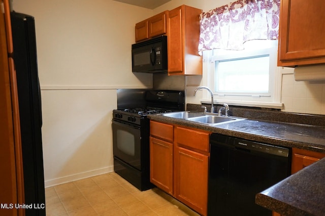 kitchen featuring tasteful backsplash, sink, and black appliances