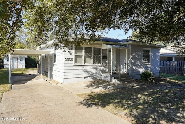 view of front of home featuring a carport