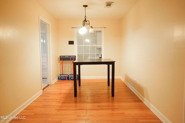 dining room with hardwood / wood-style flooring