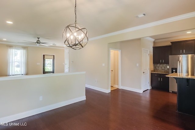 interior space with backsplash, decorative light fixtures, crown molding, dark hardwood / wood-style floors, and stainless steel refrigerator with ice dispenser