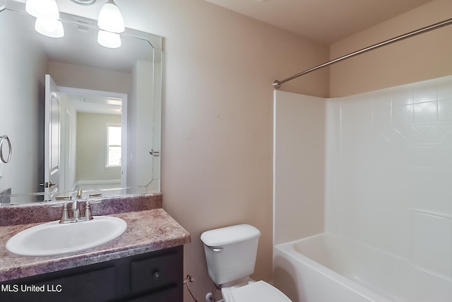 full bathroom with toilet, vanity, and shower / bathtub combination