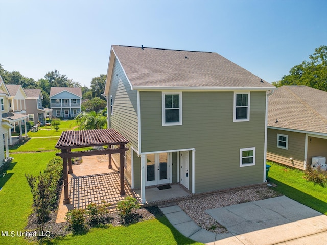 back of property featuring a patio and a yard