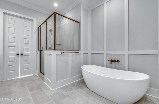 bathroom with shower with separate bathtub, tile patterned floors, and crown molding