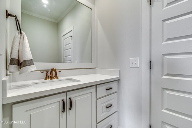 bathroom featuring vanity and crown molding