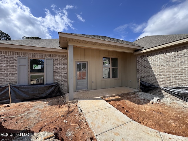 doorway to property featuring a patio area