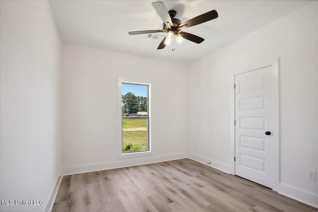 107 NE Adams Ave, Magee, MS 39111 - empty room featuring wood finished floors, baseboards, and ceiling fan