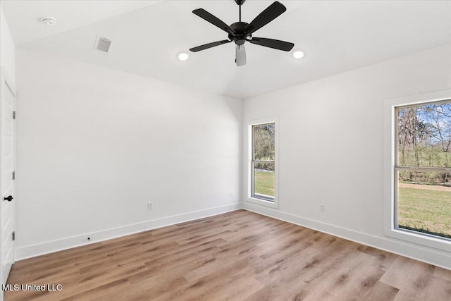 107 NE Adams Ave, Magee, MS 39111 - empty room featuring healthy amount of natural light, light wood-type flooring, baseboards, and recessed lighting