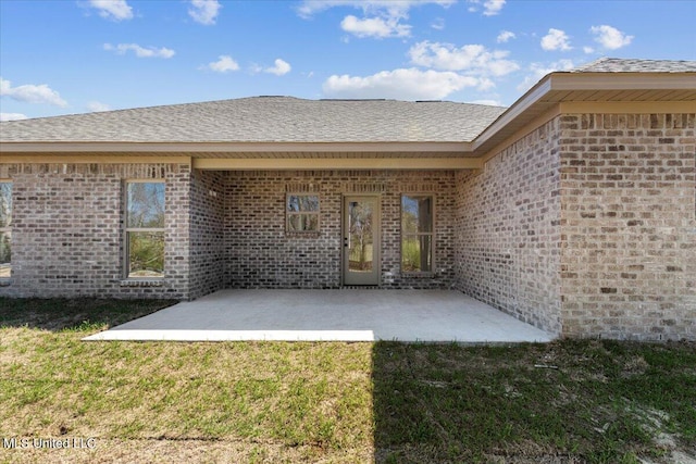 107 NE Adams Ave, Magee, MS 39111 - rear view of house with a yard and brick siding