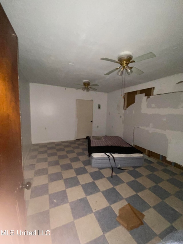 interior space featuring ceiling fan