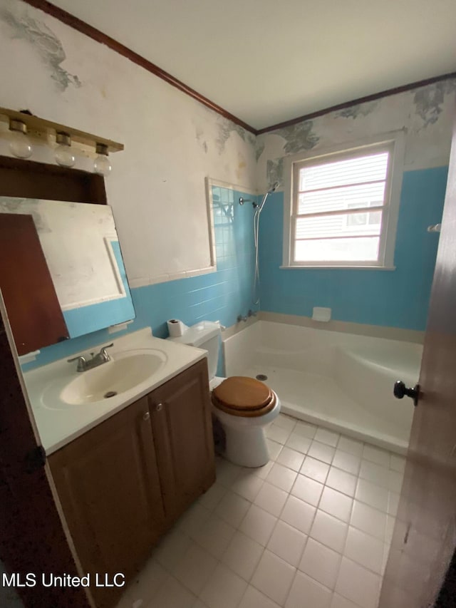 bathroom featuring toilet, a shower, vanity, and tile patterned floors