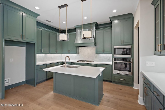 840 Glenwild Cir, Canton, MS 39046 - kitchen featuring appliances with stainless steel finishes, a sink, green cabinets, and recessed lighting