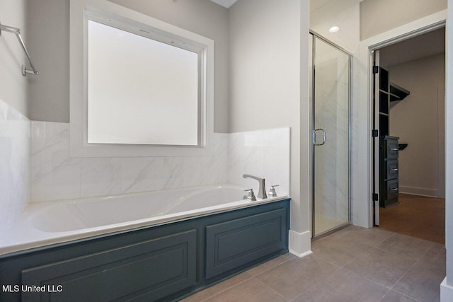 840 Glenwild Cir, Canton, MS 39046 - full bath with a garden tub, a stall shower, and tile patterned flooring