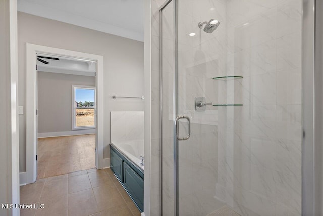 840 Glenwild Cir, Canton, MS 39046 - bathroom with a stall shower, a garden tub, tile patterned flooring, and baseboards