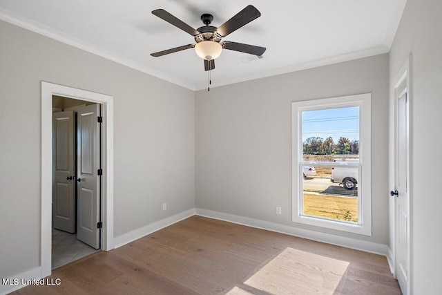 840 Glenwild Cir, Canton, MS 39046 - unfurnished bedroom featuring ornamental molding, wood finished floors, baseboards, and ceiling fan