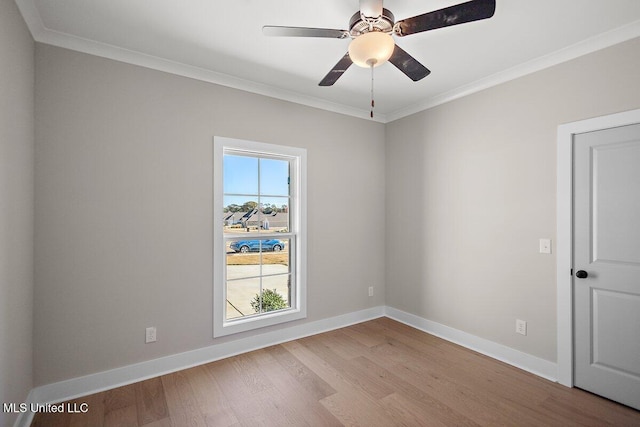 840 Glenwild Cir, Canton, MS 39046 - empty room with ornamental molding, wood finished floors, baseboards, and a ceiling fan